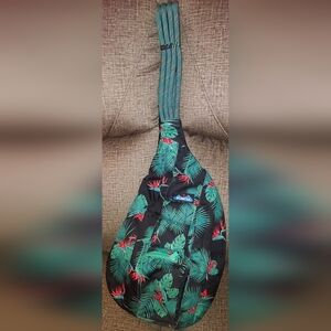Kavu One-Piece Sling Bag in Black with Green and Red Tropical Print